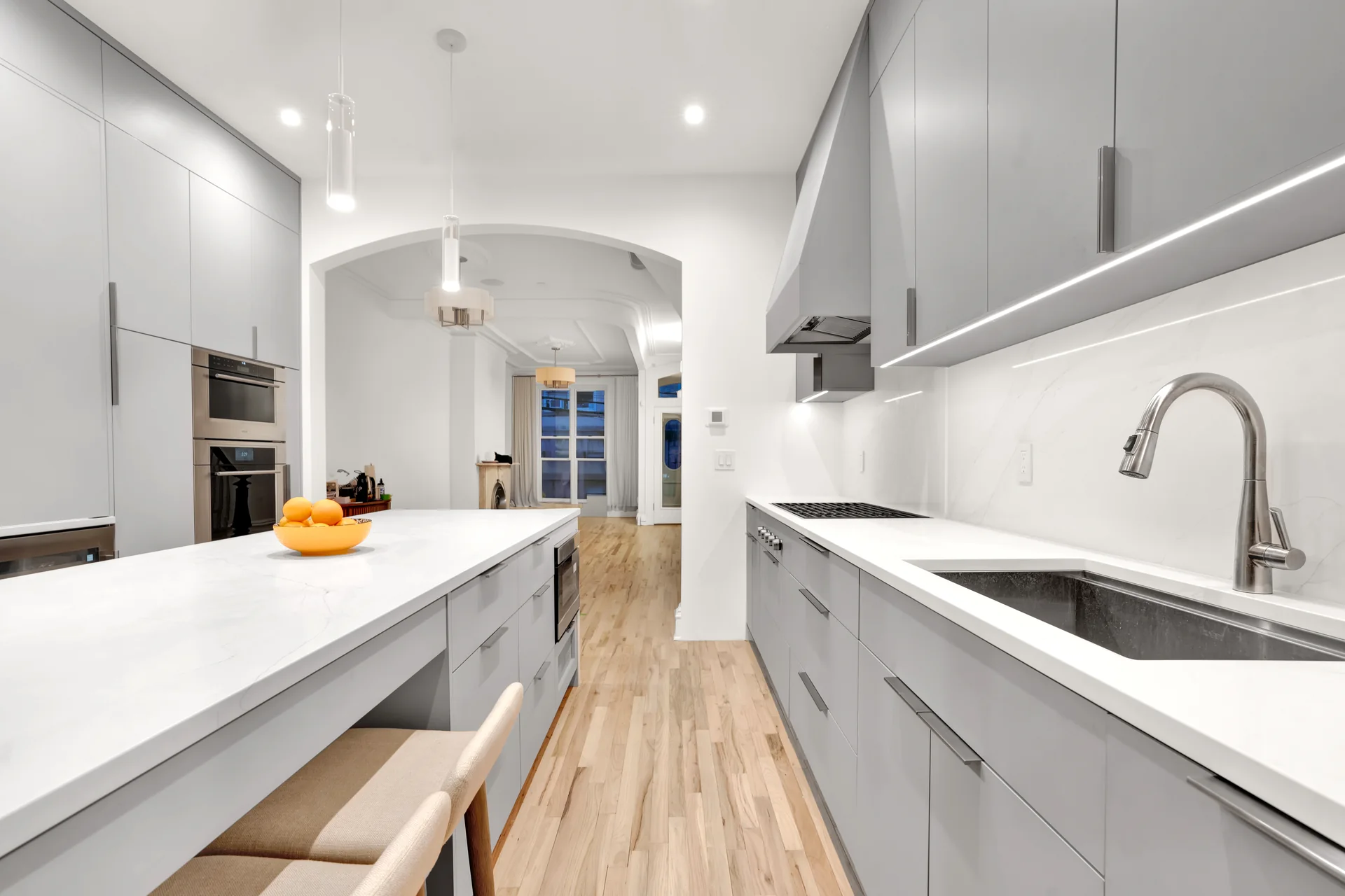 Kitchen aisle between the island and sink cabinetry