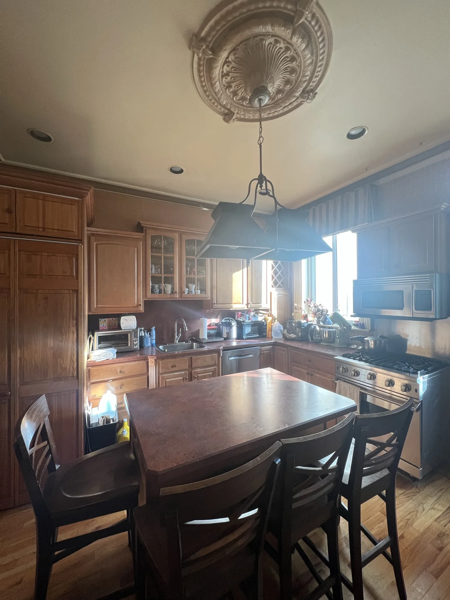 Wood kitchen cabinetry before the renovation