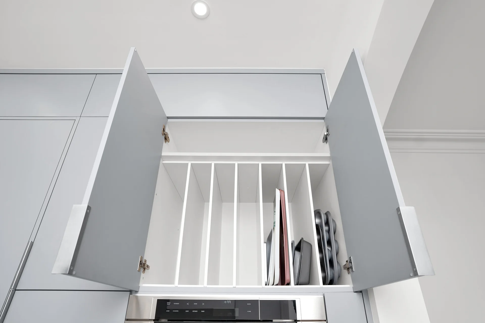 Open upper cabinet with vertical storage dividers